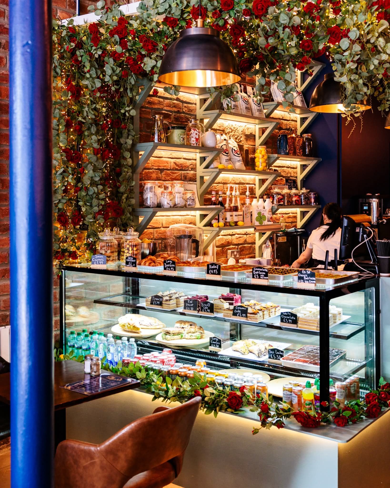 The Cafe Amara cake display counter with fresh pastries and cakes